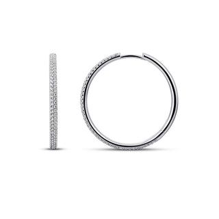 A pair of silver hoop earrings with pavé-set clear stones, shown from the side and front on a clean white background.