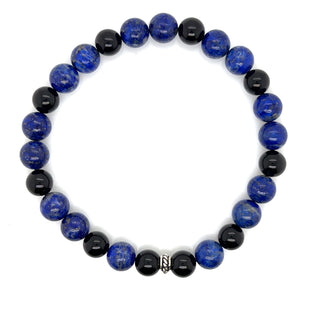 Bracelet with blue and black beads on a white background