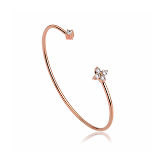 Rose gold bracelet with small diamonds on a white background