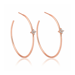 Rose gold hoop earrings with small diamond-like stones on a white background