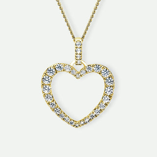 Heart-shaped diamond pendant on a gold chain against a white background