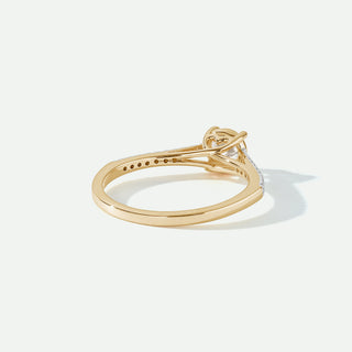 Gold ring with a diamond on a white background