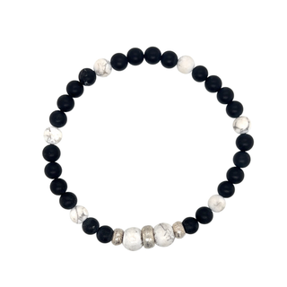 Bracelet with black, white, and silver beads on a white background