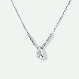 Diamond necklace on a light gray background