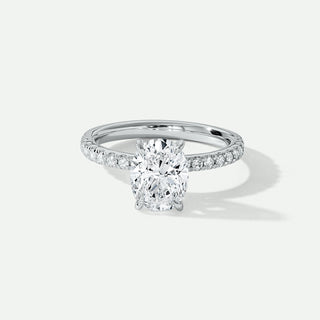 Diamond ring with a oval-shaped center stone on a light gray background