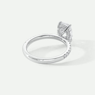 Silver ring with a diamond on a light gray background