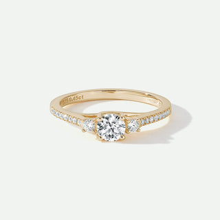 Gold ring with diamonds on a white background