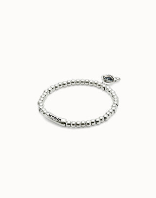 Silver beaded bracelet with a black gemstone on a white background