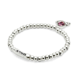 Silver beaded bracelet with a pink gemstone charm on a white background