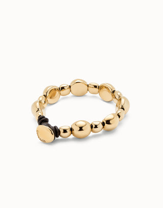 Gold beaded bracelet on a white background