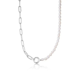 A silver chunky link chain necklace with gold plating, featuring a series of pearl beads and a chunky gold link pendant.
