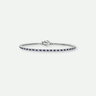 Silver bracelet with blue stones on a white background