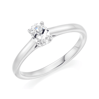 A platinum band ring with a central oval-shaped claw-set diamond, featuring a D colour grade and internally flawless clarity.