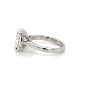 Silver ring with a diamond on a white background