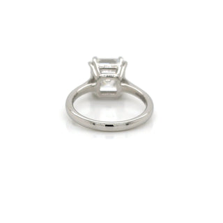 Platinum ring with a diamond on a white background
