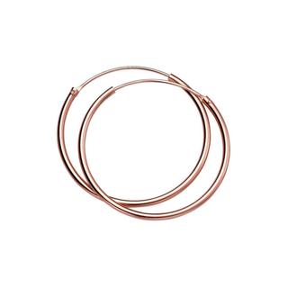 Rose gold hoop earrings on a white background