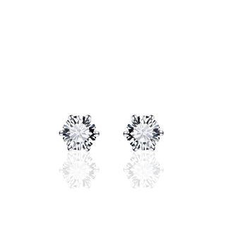 Pair of diamond stud earrings on a white background