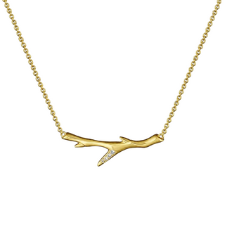 Gold shaun leane 
necklace with branch-like pendant on a white background