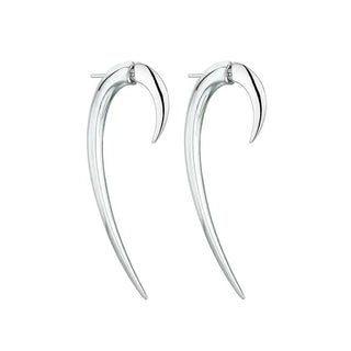 A pair of hook earrings crafted from sterling silver, with a sleek and elongated silhouette.