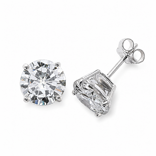 A pair of round-cut diamond stud earrings in a silver-toned setting, shown on a clean white background with one earring facing forward and the other angled to show the post and backing.
