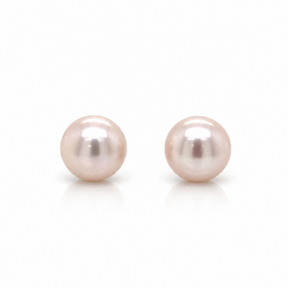 A pair of round freshwater pearl stud earrings in a soft pinkish-white hue, displayed on a clean white background with subtle reflections below.
