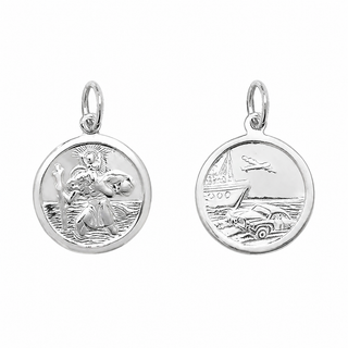 Two silver round medallion charms shown side by side on a plain white background. The left charm is engraved with a religious figure and rays, and the right charm shows a nautical scene with a boat, car, and airplane.
