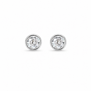 Gold earrings with clear gemstones on a white background