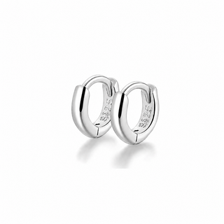 A pair of polished sterling silver huggie hoop earrings with a polished finish and '925' silver purity stamp inside, shown on a clean white background with a soft reflection.