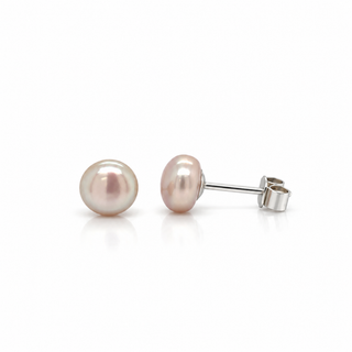 A pair of freshwater pearl stud earrings with a soft pink luster and silver post-back settings, displayed on a clean white background.