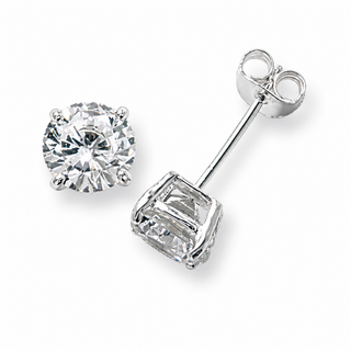 A pair of silver stud earrings, one shown from the front as a round brilliant-cut diamond and the other from the side showing the rectangular baguette-cut diamond and post, on a white background.