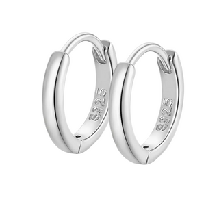A pair of polished sterling silver huggie hoop earrings with '925' silver purity stamped on the inside, shown on a clean white background.