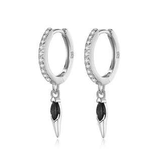 A pair of silver hoop earrings with black CZ stones and a spike design detail at the bottom, with a rhodium finish.