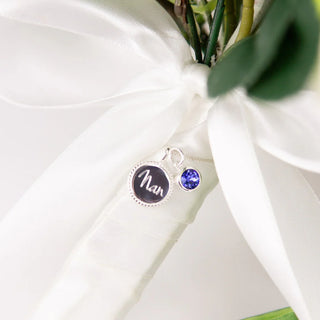 Jewelry with a 'nan' charm on a white background