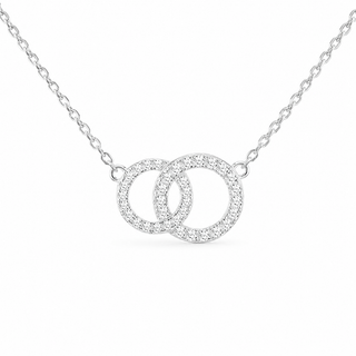 A silver chain necklace featuring two interlocking open circles, each paved with small clear stones, shown on a plain white background.