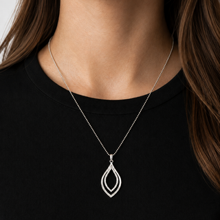Silver necklace with a teardrop pendant on a black shirt
