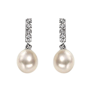 A pair of silver drop earrings featuring lustrous pearls at the bottom and sparkling cubic zirconia stones along the sleek silver bars.