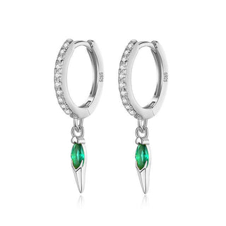 A pair of silver hoop earrings with vibrant green cubic zirconia charms attached to the hoops, displayed against a white background.