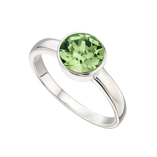 Silver ring with a green gemstone on a white background