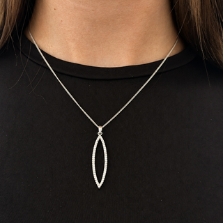 Silver necklace with a pendant on a black background