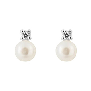 A pair of stud earrings featuring a freshwater pearl atop a sparkling cubic zirconia stone, set in silver mounting.