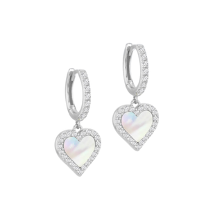 Heart-shaped earrings with mother of pearl centers on a white background