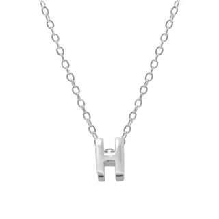 Silver necklace with a 'H' pendant on a white background