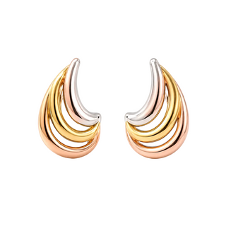 Pair of gold and silver earrings on a white background