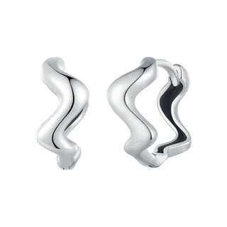 A pair of silver zig-zag hoop earrings with a rhodium finish.