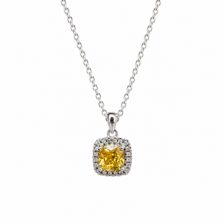 A silver chain necklace with a cushion-cut halo pendant featuring a bright yellow center stone surrounded by small clear accent stones, shown on a plain white background.