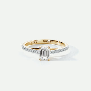 Gold ring with a diamond on a white background