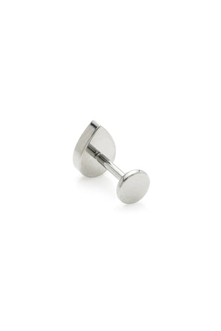 Pear shaped silver earring on a white background