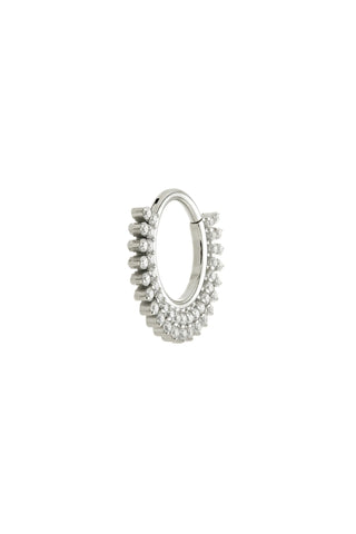 Silver hoop earring with embedded stones on a white background