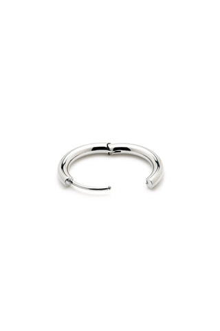 Silver hoop earring on a white background