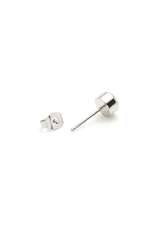 Pair of silver stud earrings on a white background